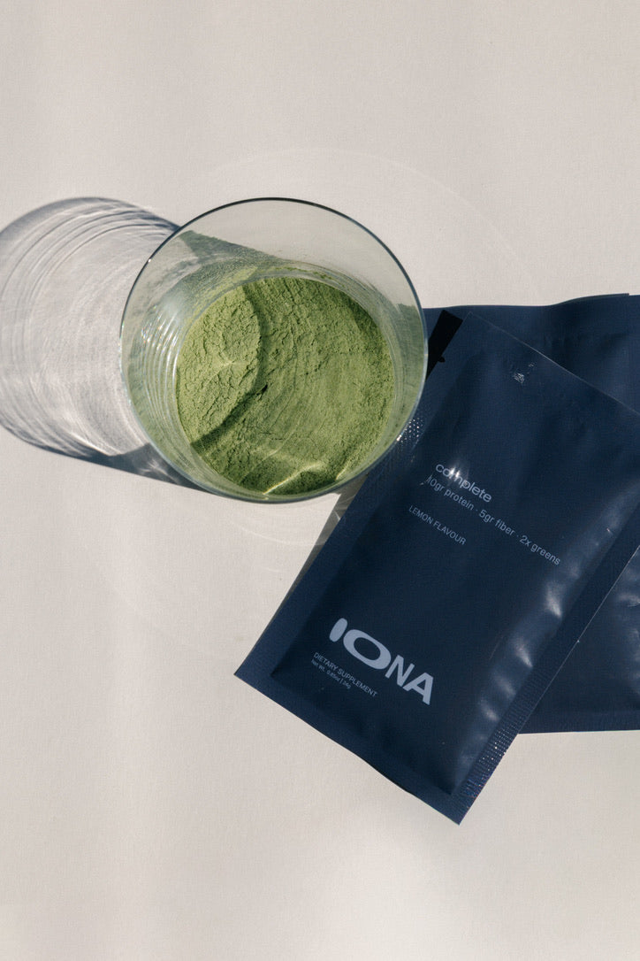 Powder, glass, and sachets flat-lay
